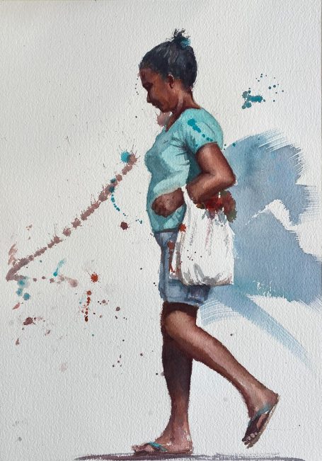 Brazilian woman Brazilian woman walking down a street in hot sun